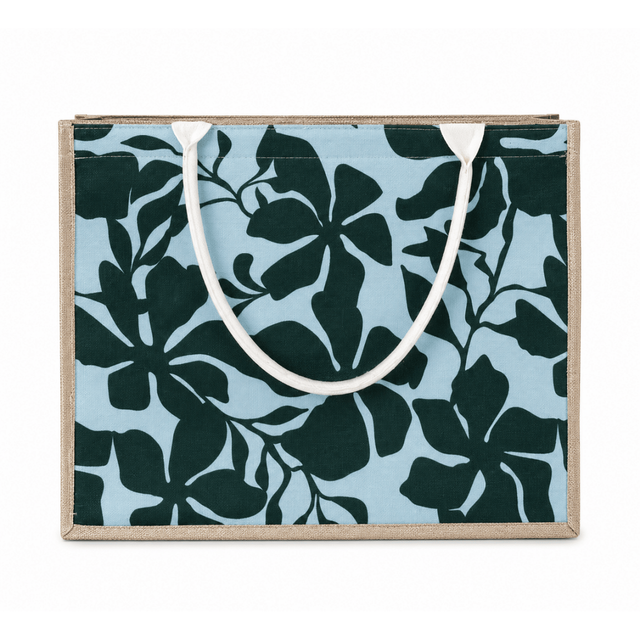Floral-patterned bag with a white handle on a light blue background - okotoks hc pharmacy