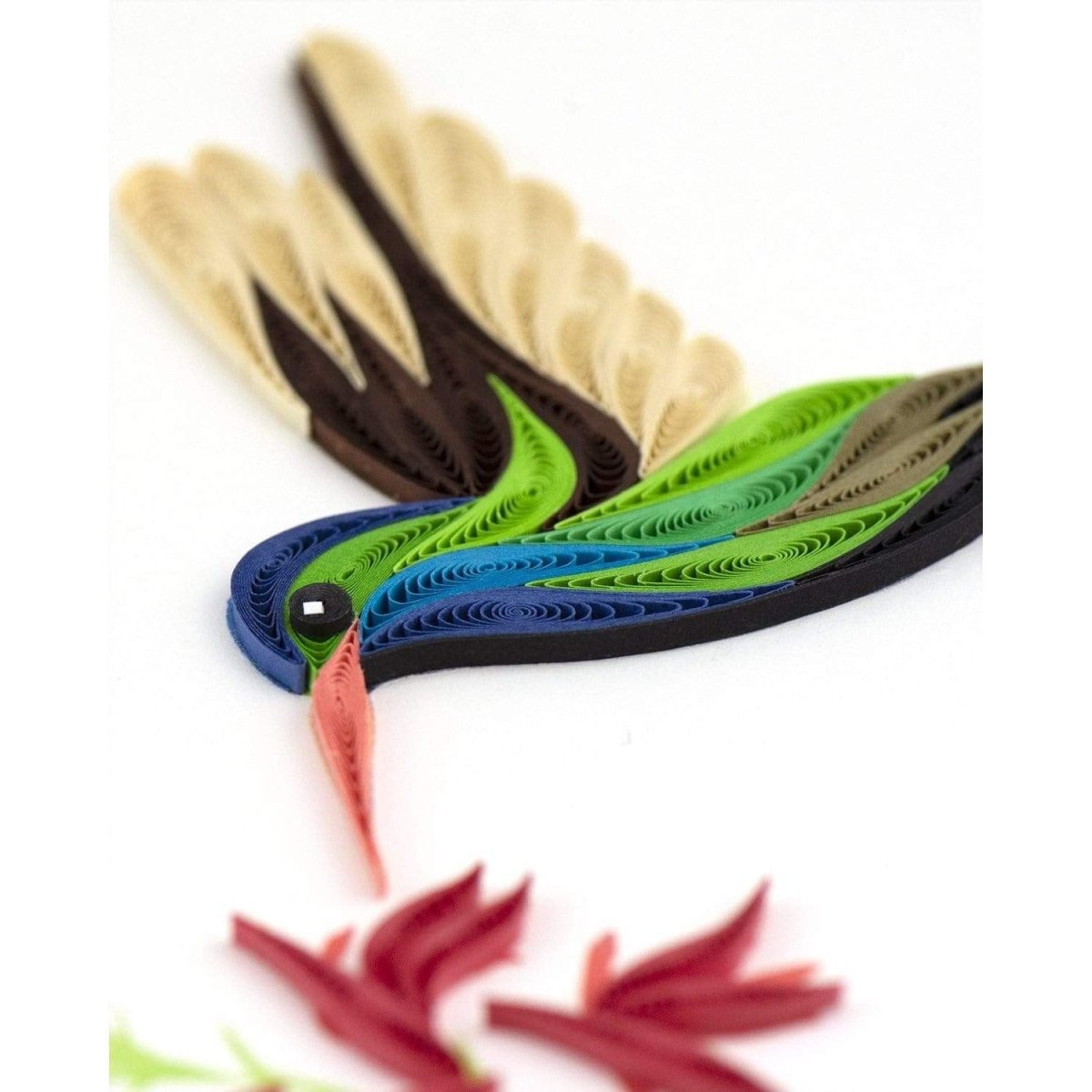 Colorful quilled paper bird on a white background - okotoks hc pharmacy