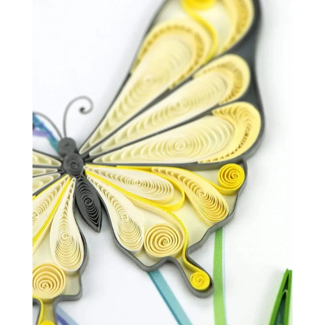 Quilled butterfly art with yellow and gray patterns on a white background - okotoks hc pharmacy