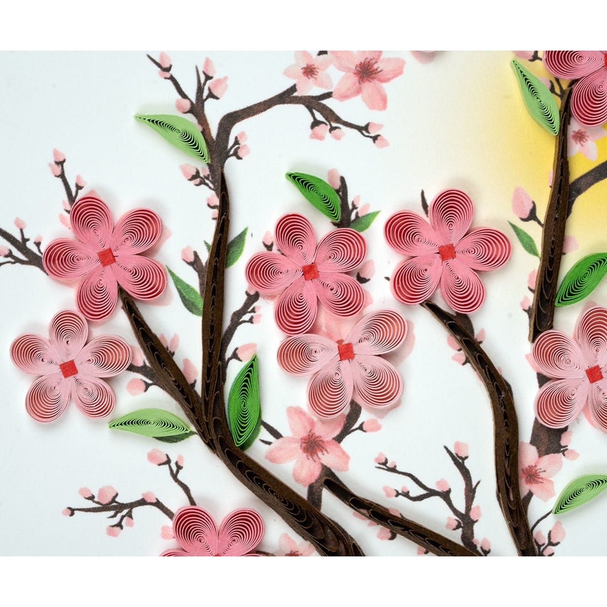 Quilled cherry blossom design with pink flowers and green leaves on a white background - okotok hc pharmacy