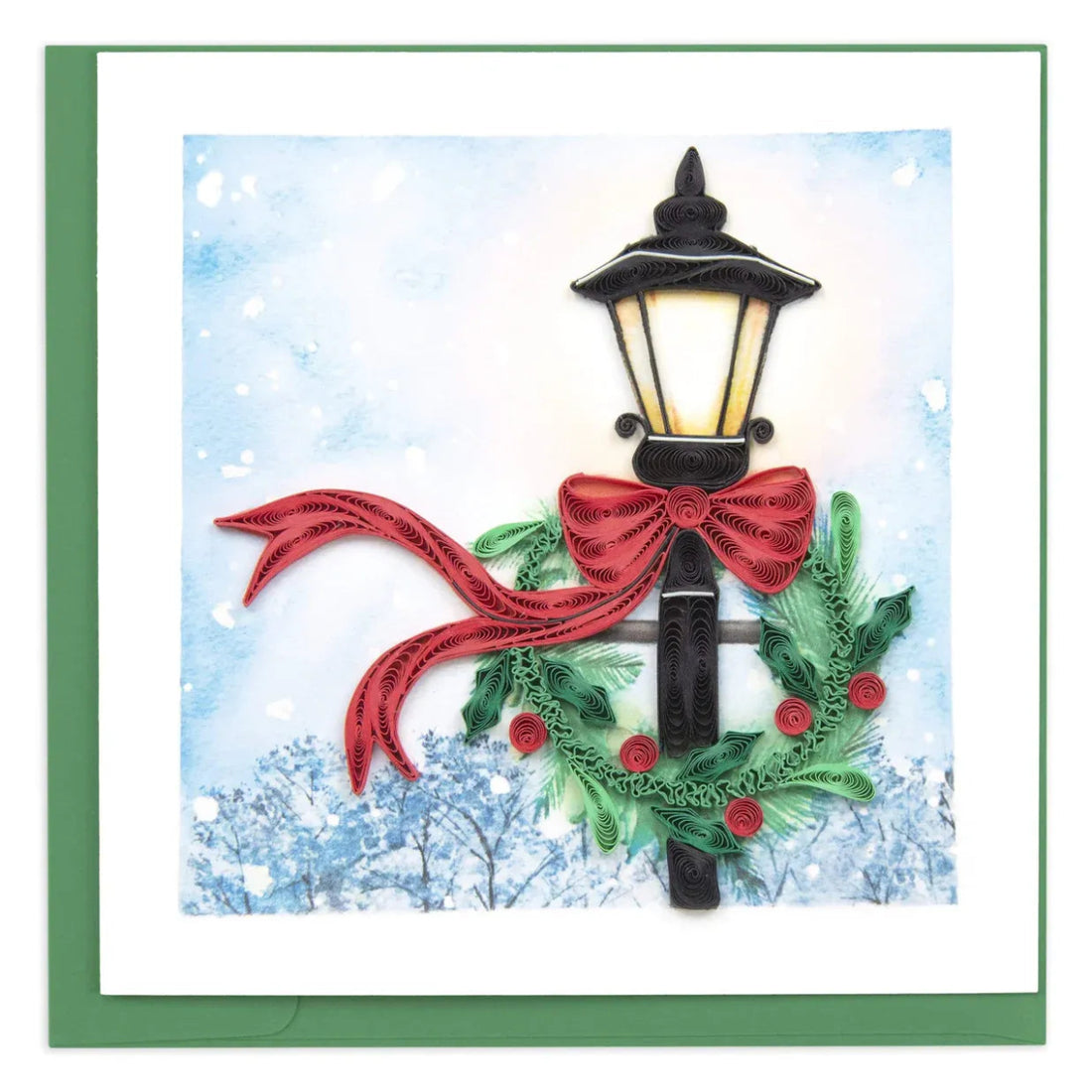 Decorative card with a Christmas-themed street lamp, red ribbon, greenery against a snowy background - okotoks hc pharmacy