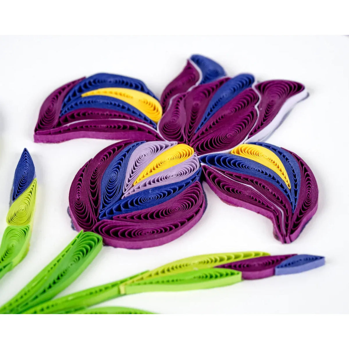 Colorful quilled paper flower on a white background - okotoks hc pharmacy