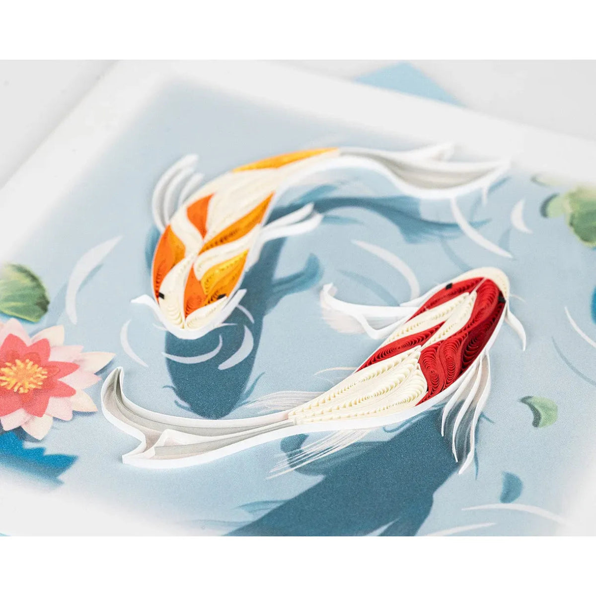 Two colorful koi fish swimming in water with lily pads and ripples. - okotoks hc pharmacy