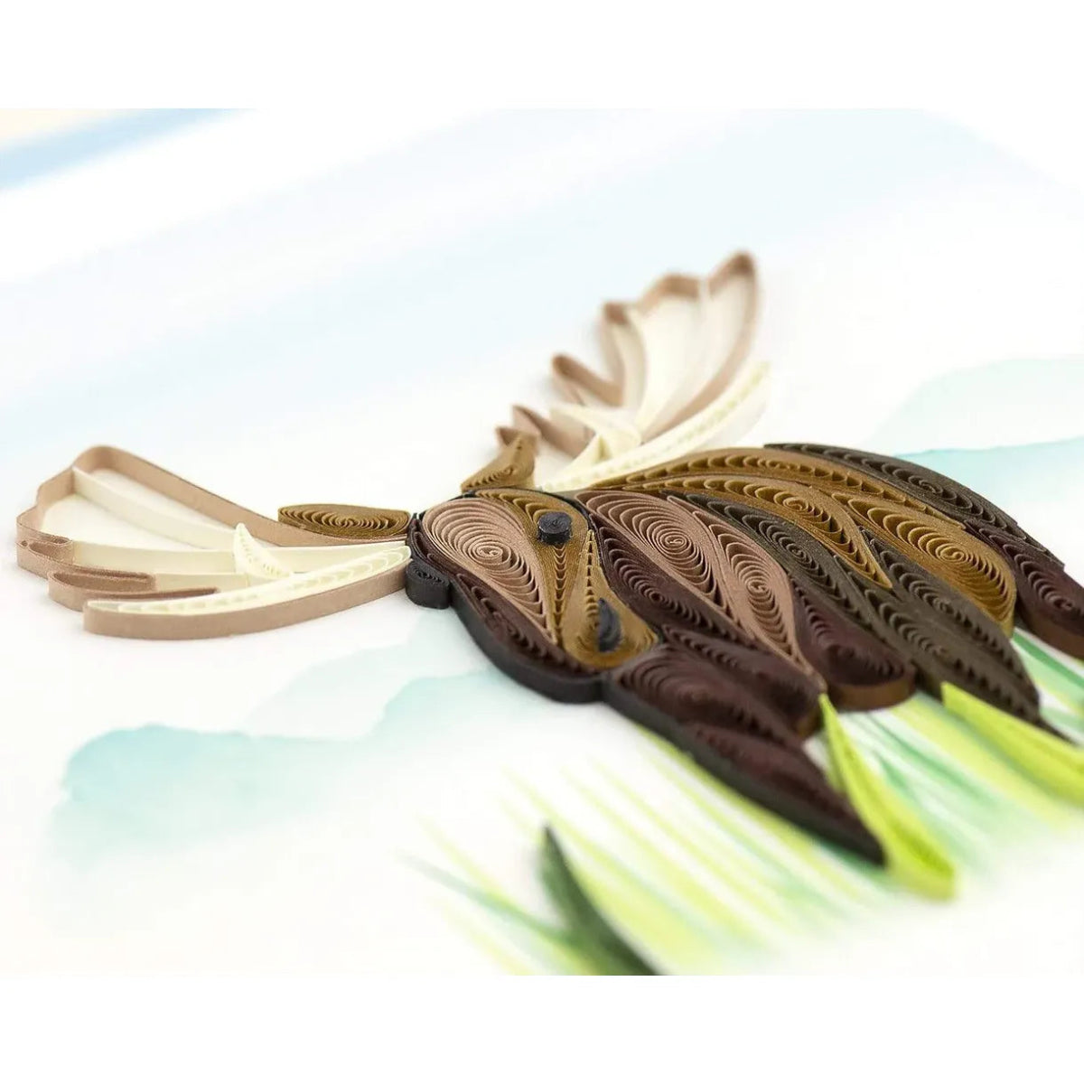 Quilled paper moose on a light background - okotoks hc pharmacy