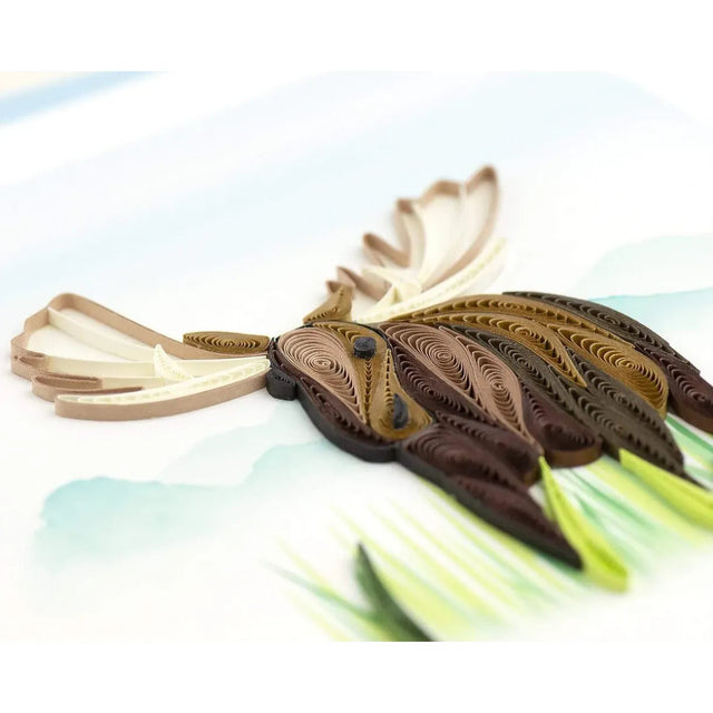 Quilled paper moose on a light background - okotoks hc pharmacy