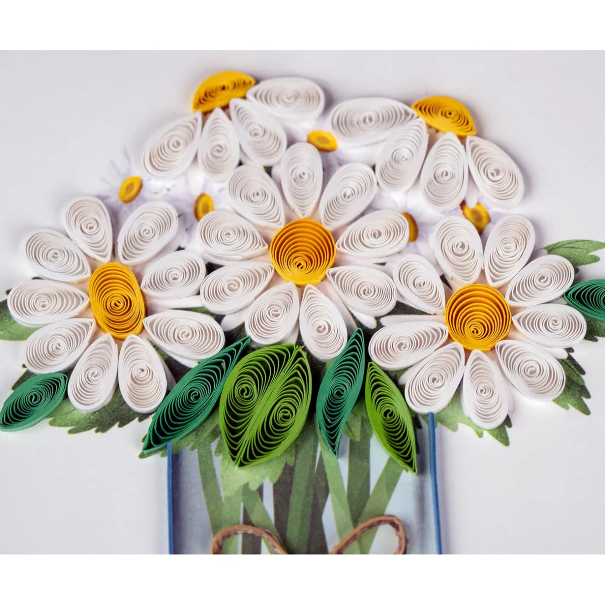 Quilled paper flower art with white petals, yellow centers, and green leaves on a white background. - okotoks hc pharmacy