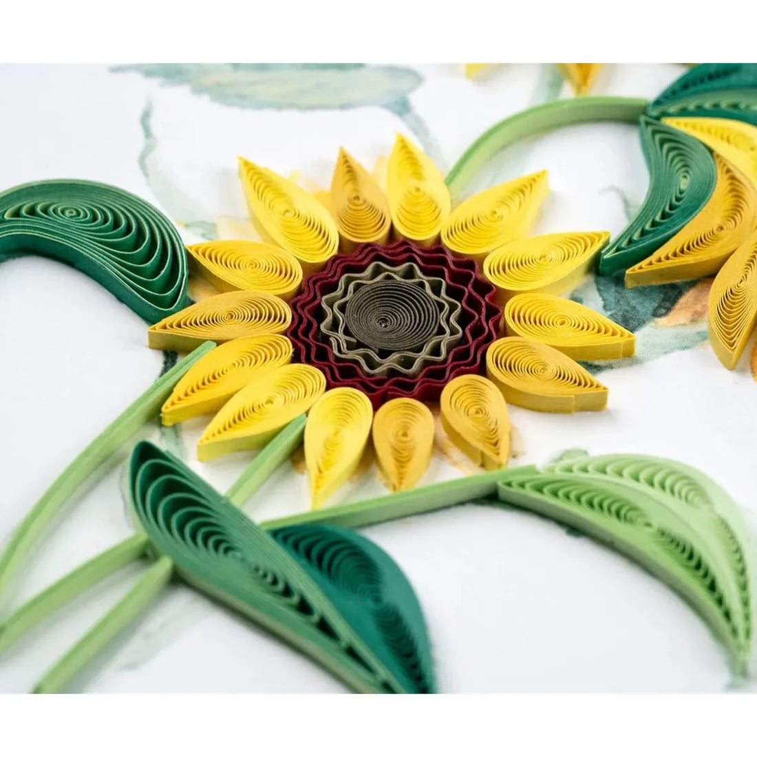 Quilled paper sunflower with green leaves on a white background - okotoks hc pharmacy