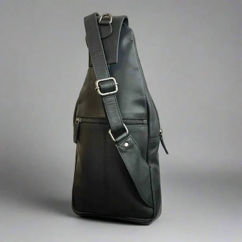 Black leather sling bag on a gray background - okotoks hc pharmacy