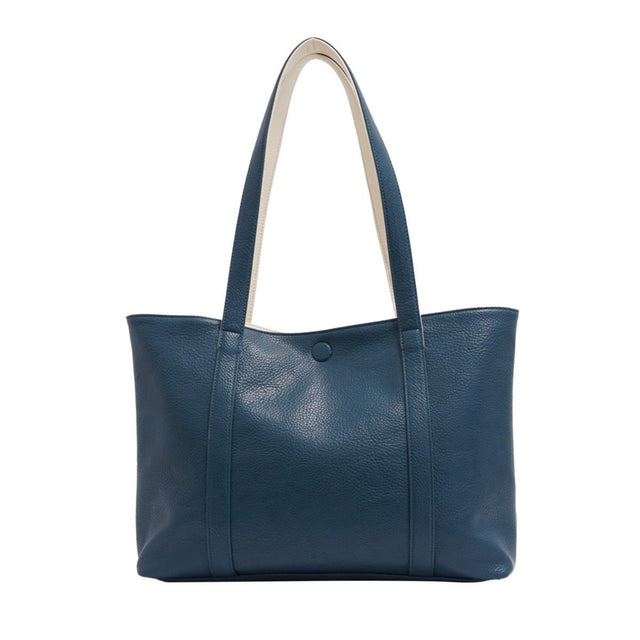 Blue leather tote bag with a white handle on a white background - okotoks hc pharmacy