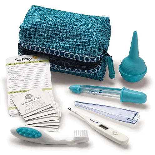 First aid kit with blue mesh pouch, alcohol wipes, thermometer, and other medical supplies on a white background. - okotoks hc pharmacy