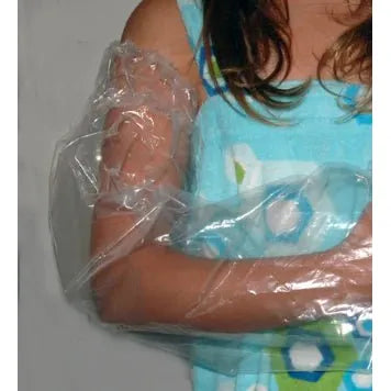 Child in a blue swimsuit with a transparent plastic bag over one arm, sitting on a white surface. - okotoks hc pharmacy