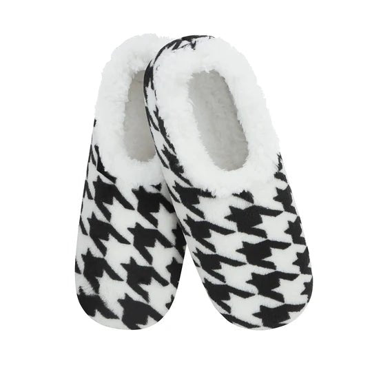 Pair of black and white houndstooth patterned slippers with white interior on a white background - okotoks hc pharmacy