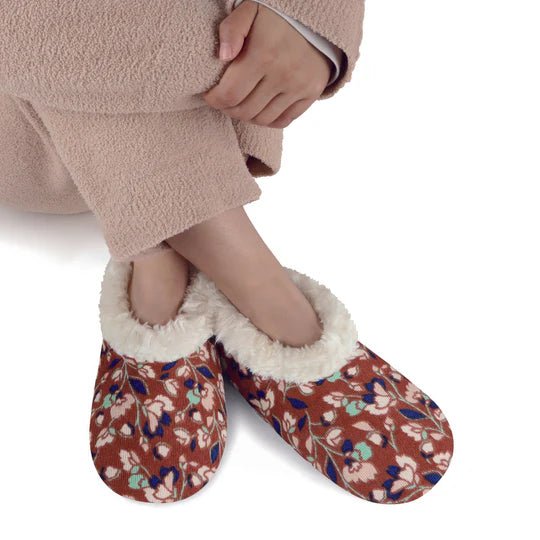 Floral patterned slippers with white fur lining worn by a person on a white background - okotoks hc pharmacy