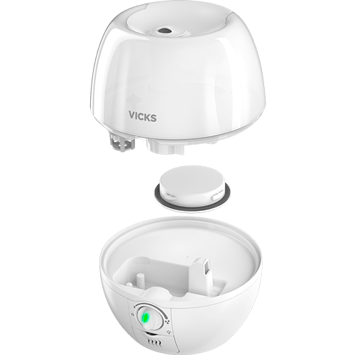 A white Vicks humidifier shown in an exploded view, with the top dome lid and bottom bowl base separated to display the internal components and control button. - okotoks hc pharmacy