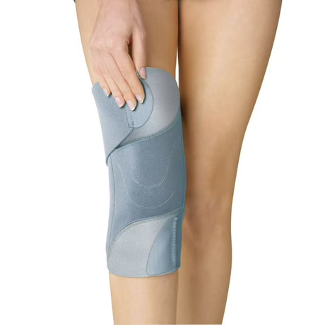 Blue knee brace on a person's leg with a white background - okotoks hc pharmacy