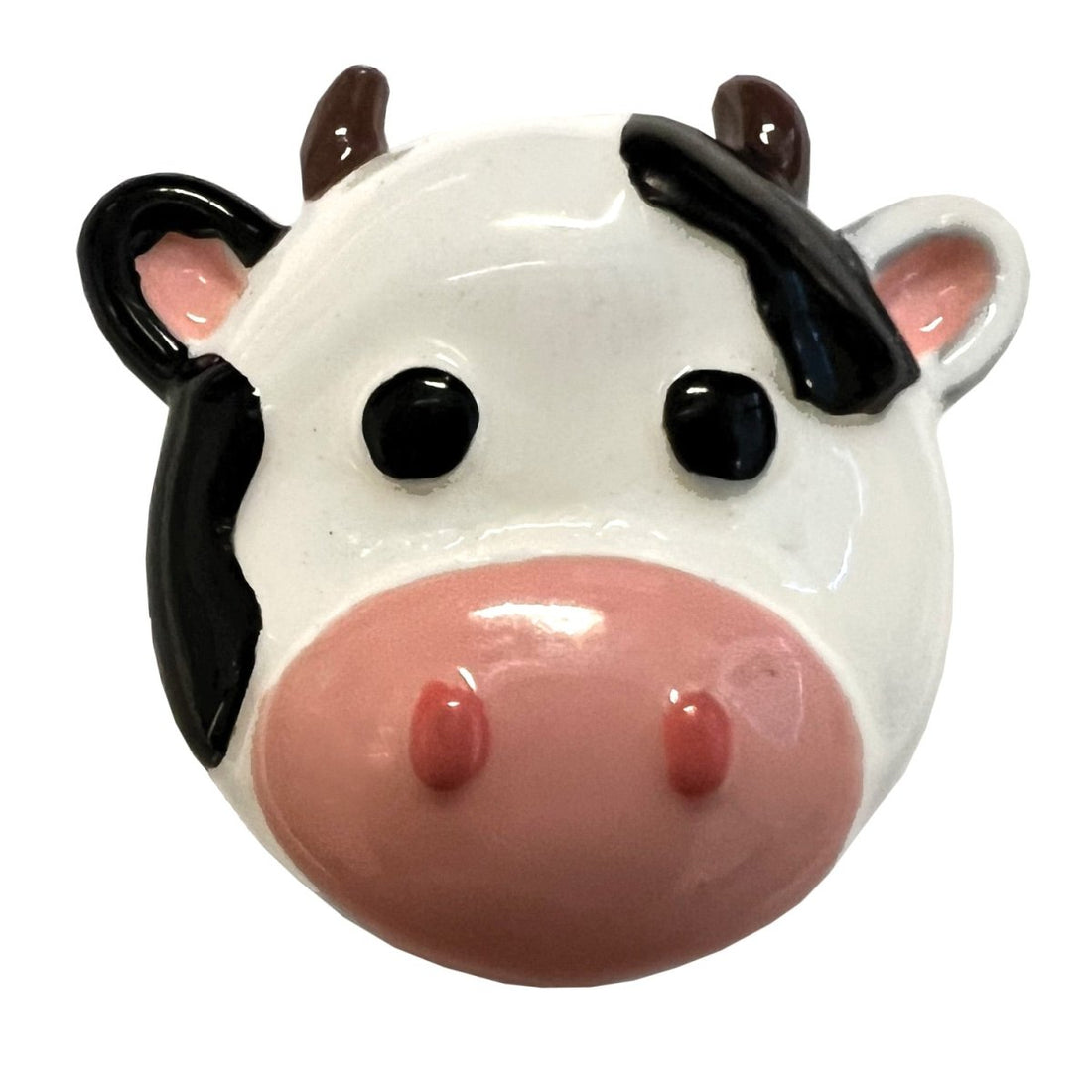 Ceramic cow-shaped with black and brown accents on a white background - okotoks hc pharmacy