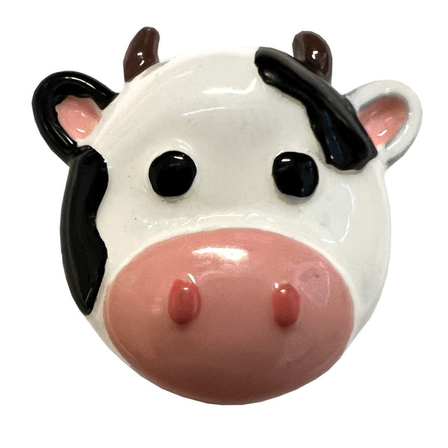 Ceramic cow-shaped with black and brown accents on a white background - okotoks hc pharmacy