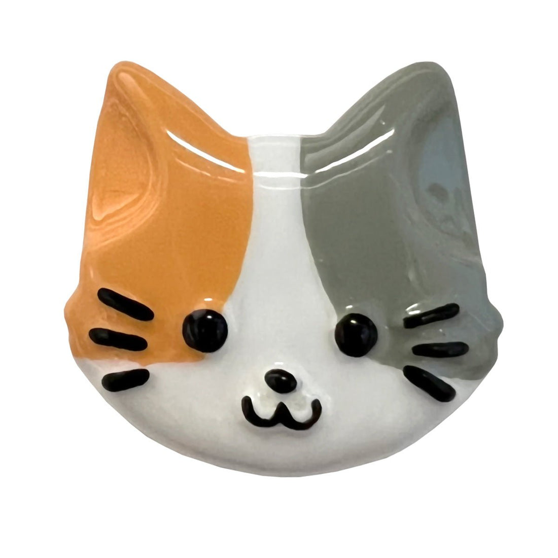 Ceramic cat-shaped with orange, gray, and white colors on a white background - okotoks hc pharmacy