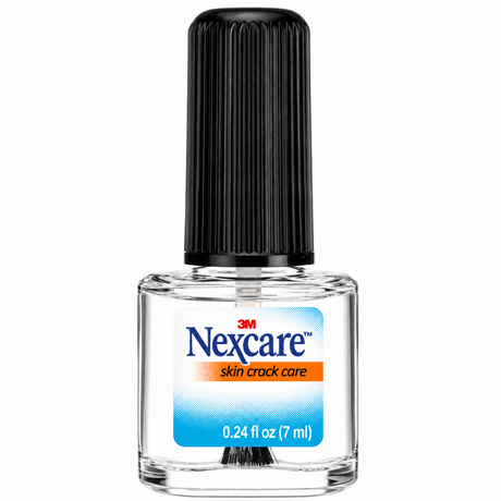 A bottle of 3M Nexcare skin crack care nail treatment with a black ribbed cap, clear glass bottle, and a blue and orange label on a white background. - okotoks hc pharmacy