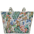 Tote bag with a tropical design featuring leopards, flowers, and leaves on a white background. - okotoks hc pharmacy