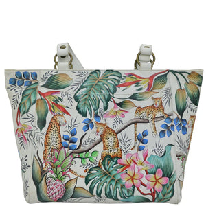 Tote bag with a tropical design featuring leopards, flowers, and leaves on a white background. - okotoks hc pharmacy