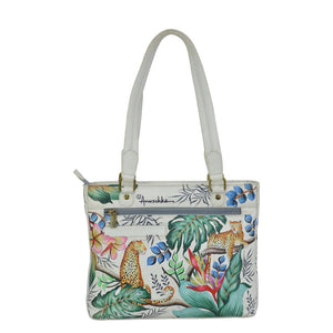 Handbag with a tropical design featuring leopards and foliage on a white background - okotoks hc pharmacy