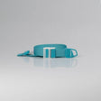 A turquoise blue web belt with a white plastic buckle, shown coiled on a light gray reflective studio surface. - okotoks hc pharmacy