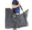 Person holding a large gray bag with 'SAMYLIOR' branding on a white background - okotoks hc pharmacy