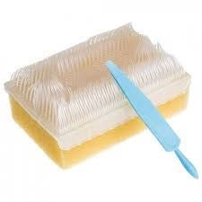 Yellow sponge with a blue handle on a white background - okotoks hc pharmacy