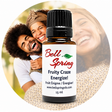 A 15 ml bottle of Bell Spring 'Fruity Craze Energize!' essential oil centered over a circular background photo of a smiling couple, with the product label clearly visible. - okotoks hc pharmacy
