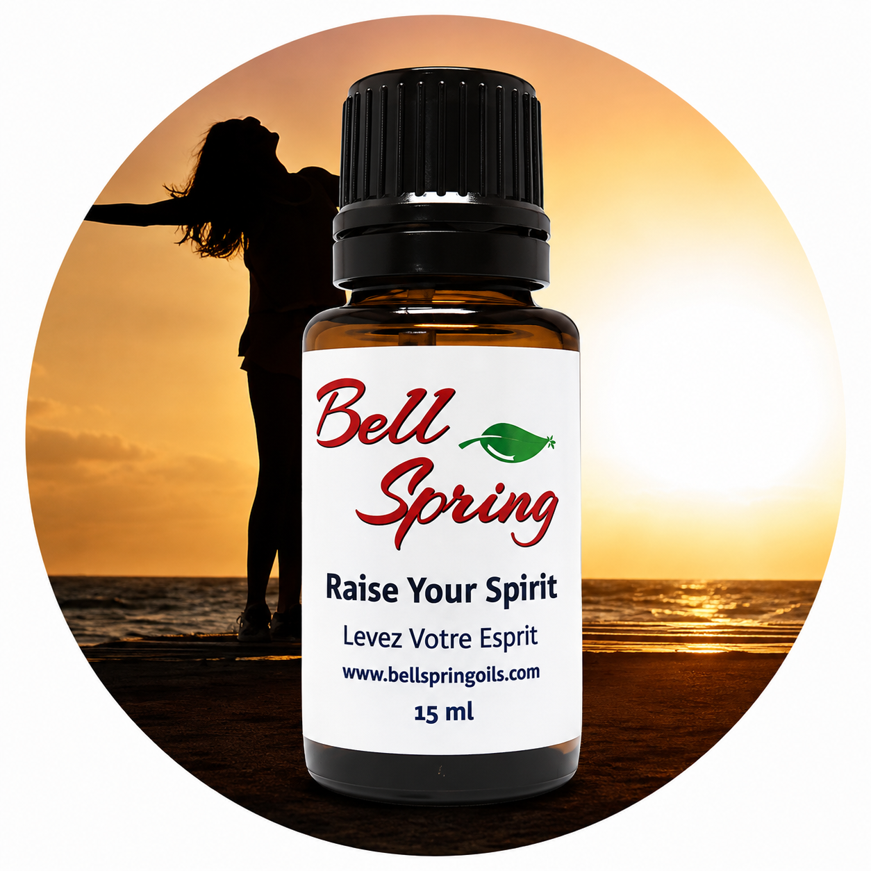 A 15 ml amber glass essential oil bottle with a black cap and a white label reading 'Bell Spring' and 'Raise Your Spirit', centered over a circular beach sunset background with a silhouetted person. - okotoks hc pharmacy