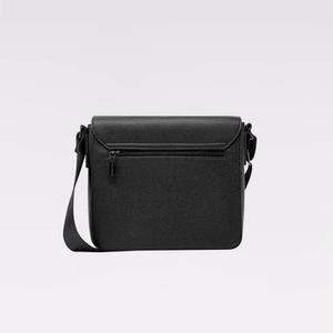 A black pebbled leather crossbody bag with a front zippered pocket and a matching shoulder strap, shown against a plain light gray background. - okotoks hc pharmacy