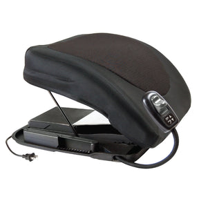 An electric lift seat in black with a textured brown mesh pad on top, shown open to reveal the internal battery pack and power cord, on a white background. - okotoks hc pharmacy