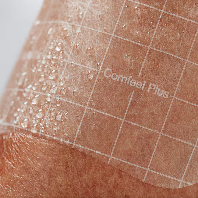 Patch labeled 'Comfeel Plus' on skin with grid overlay - okotoks hc pharmacy
