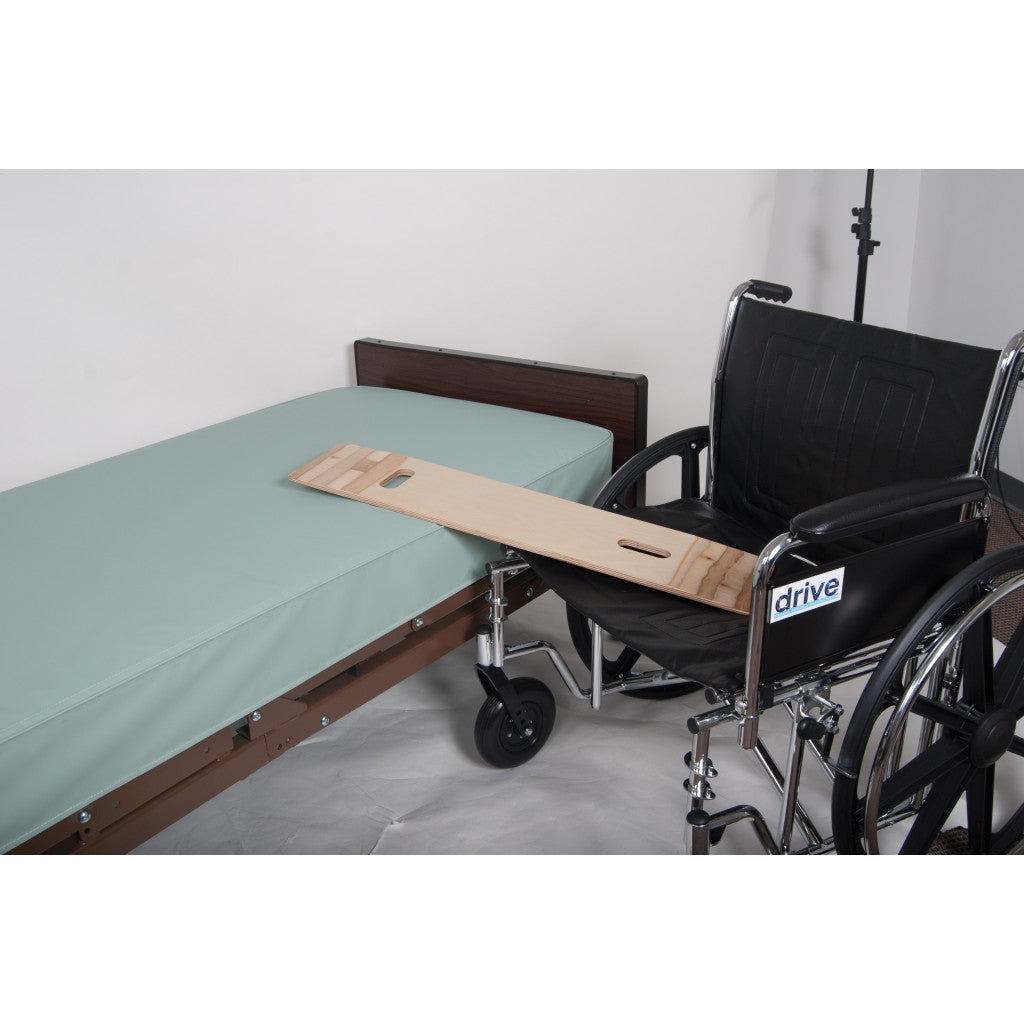 Wheelchair with a wooden board attached to a bed in a room. - okotoks hc pharmacy