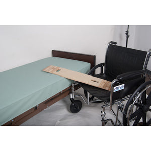 Wheelchair with a wooden board attached to a bed in a room. - okotoks hc pharmacy