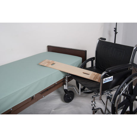 Wheelchair with a wooden board attached to a bed in a room. - okotoks hc pharmacy