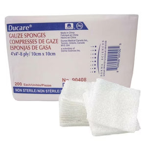 A package of Ducare Gauze Sponges with two white, folded gauze pads in front of the box on a plain white background. - okotoks hc pharmacy