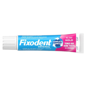 A tube of Fixodent Original Complete All Day Hold adhesive cream on a plain white background. - okotoks hc pharmacy