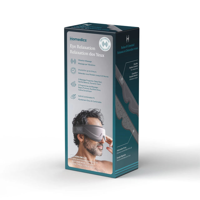 Homedics Eye Relaxation box packaging, featuring a dark teal and white design with product details and a photo of a man wearing the eye mask. - okotoks hc pharmacy