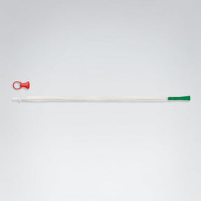 Long white catheter with red and green ends on a light gray background - okotoks hc pharmacy