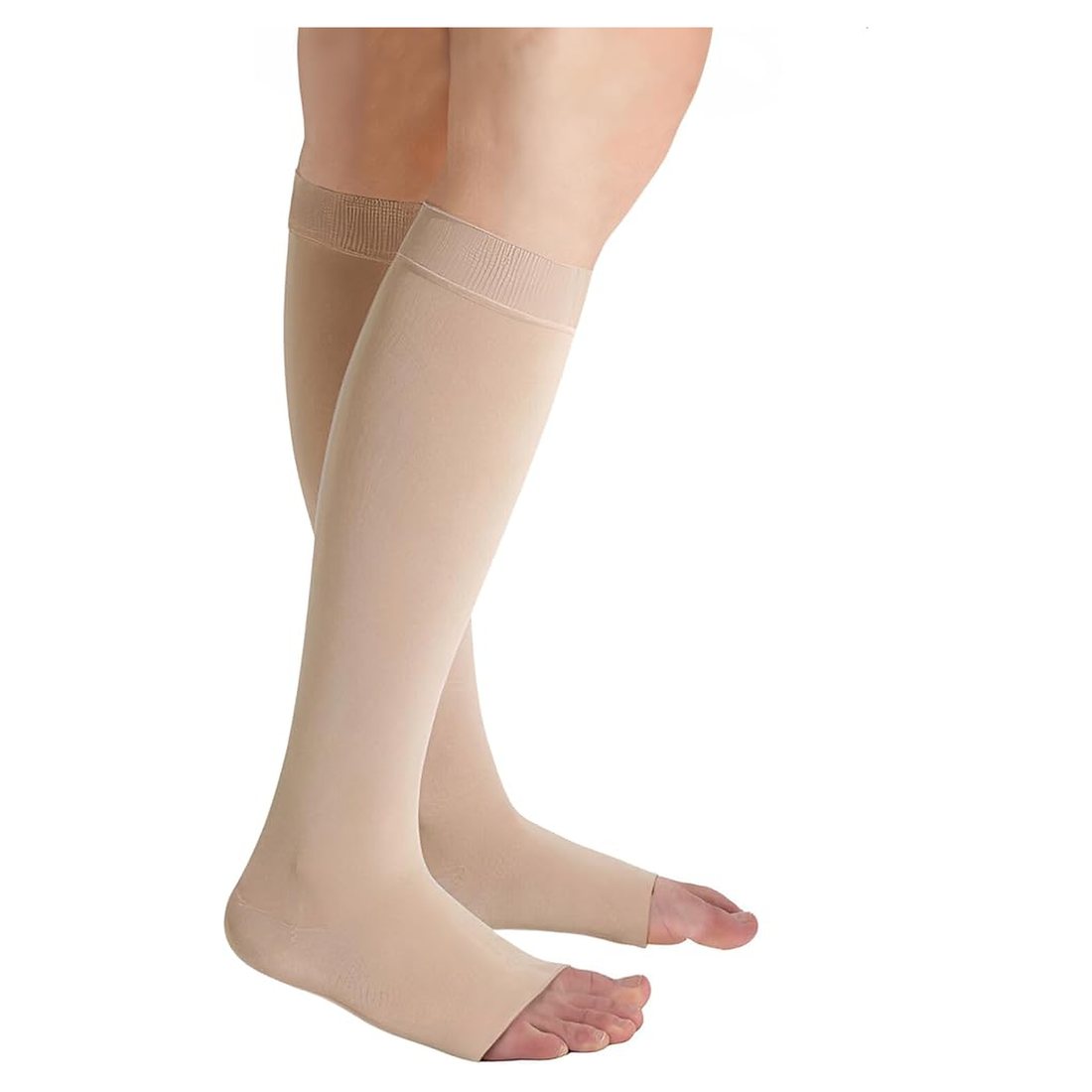 Beige over-the-calf compression socks worn on a model's legs, shown against a plain white background. - okotoks hc pharmacy