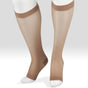 A pair of sheer knee-high compression socks or hosiery shown on a white mannequin lower leg and foot against a light gray studio background. - okotoks hc pharmacy