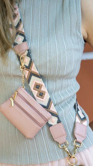Pink wallet with a patterned strap worn by a person - okotoks hc pharmacy