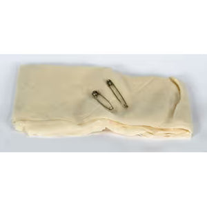 Two gold-colored pins on a beige fabric background - okotoks hc pharmacy