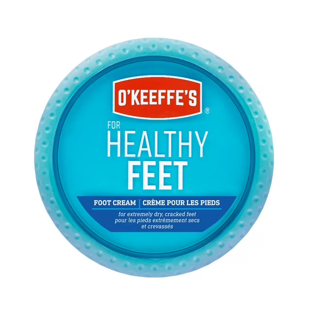 A round tin of O'Keeffe's Foot Cream for Healthy Feet, featuring a bright blue lid with a red brand logo and white text, set against a plain white background. - okotoks hc pharmacy