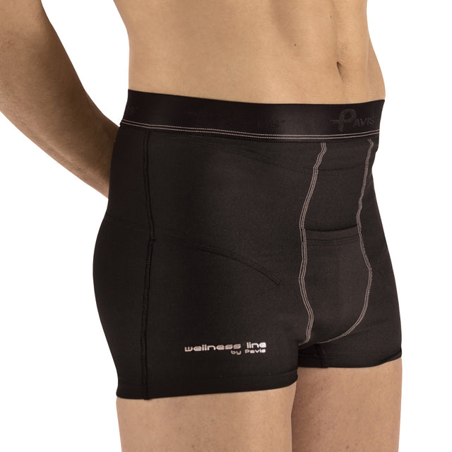 Black men's compression shorts by Paris, shown on a model from the waist down. The shorts feature a wide elastic waistband with a tonal logo, white contrast stitching, and 'wellness line by Paris' printed in white on the lower left leg. - okotoks hc pharmacy