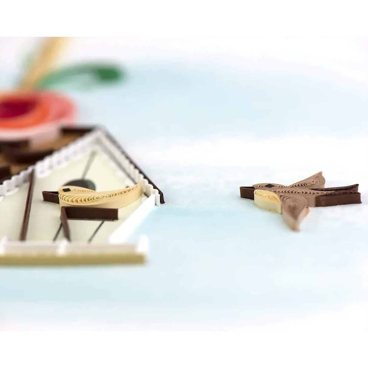 Two decorative birds on a light blue background - okotoks hc pharmacy