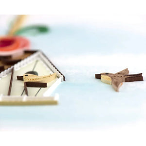 Two decorative birds on a light blue background - okotoks hc pharmacy