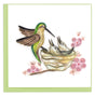Quilled artwork of a hummingbird and eggs with pink flowers on a white background - okotoks hc pharmacy